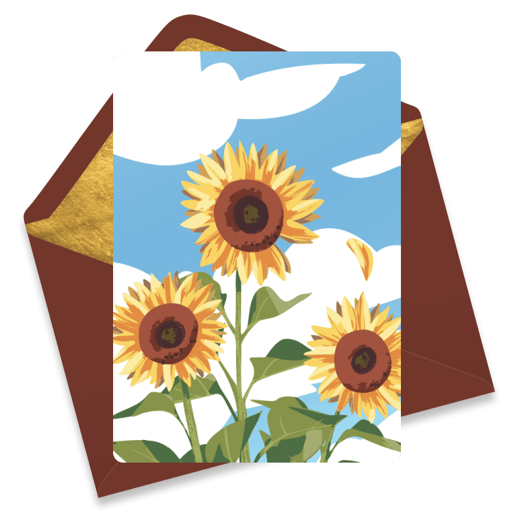 A card with tall blooming sunflowers against a blue sky and clouds.