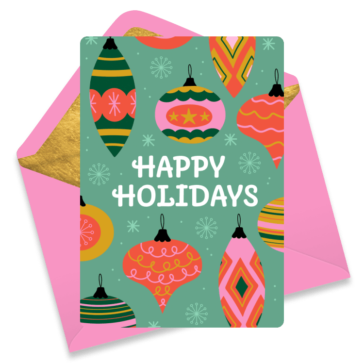 Christmas eCard with colorful hanging ornaments in pink, green, and orange, with the text 'Happy Holidays'. Pink envelope.