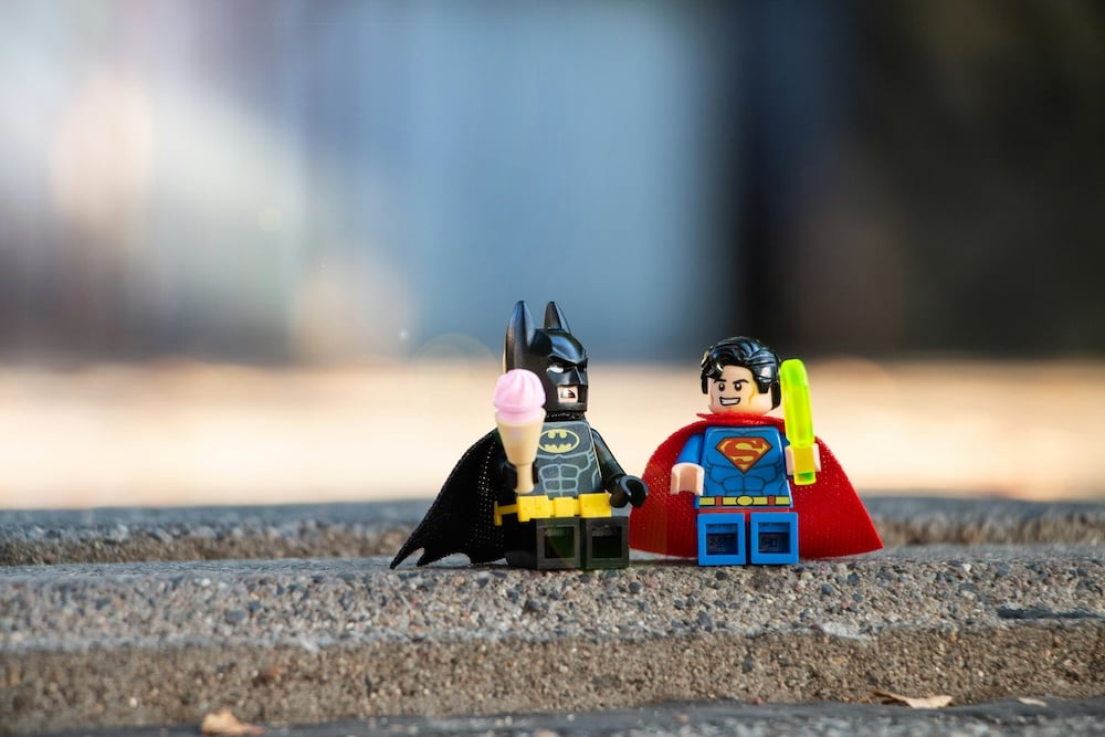 A Lego holiday gift! Lego batman and Lego Superman enjoy iced cream together.