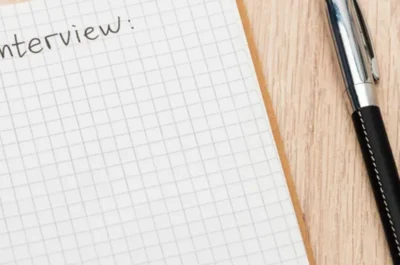An employee struggles to create a list of effective exit interview questions, leaving the numbered list blank.